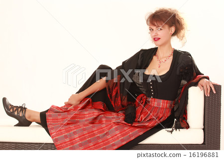 Bavarian woman in costume at rest 16196881