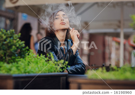 beautiful glamorous brunette smoke electronic cigarette 16198960