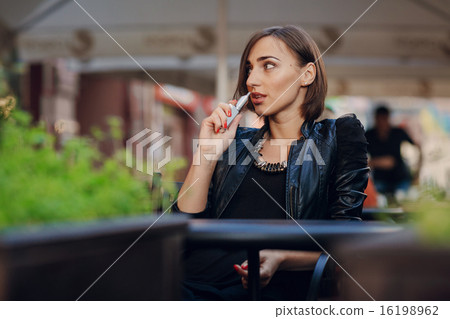 beautiful glamorous brunette smoke electronic cigarette 16198962