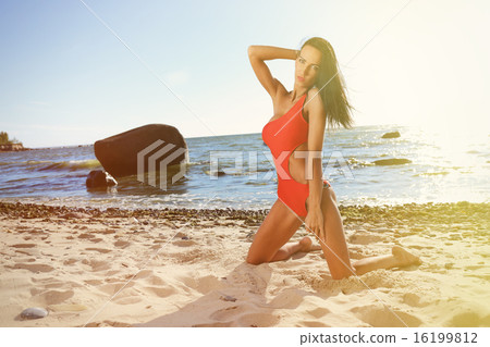 Young woman on the beach Young woman on the beach 16199812