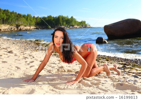 Young woman on the beach Young woman on the beach 16199813