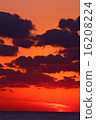 Coast of sunset glowing clouds 16208224