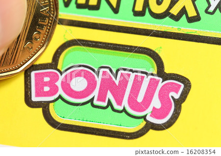 Close up woman scratching lottery ticket 16208354