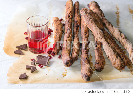 Grissini bread and red liqueur Grissini bread and red liqueur 16211330