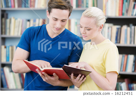 Students reading books in library Students reading books in library 16212451
