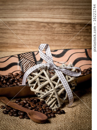 pile of fresh coffee beans, heart and spoon 16221744