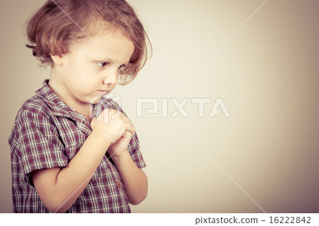 Portrait of a sad little boy Portrait of a sad little boy 16222842