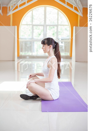 sport fitness woman doing yoga exercises in gym 16226676