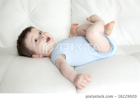 baby boy relaxing in sofa at home 16229920
