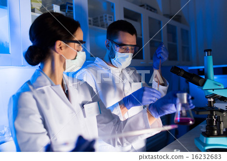 close up of scientists making test in lab 16232683