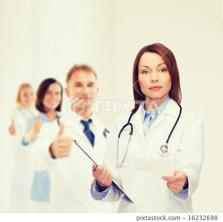 calm female doctor with clipboard calm female doctor with clipboard 16232698