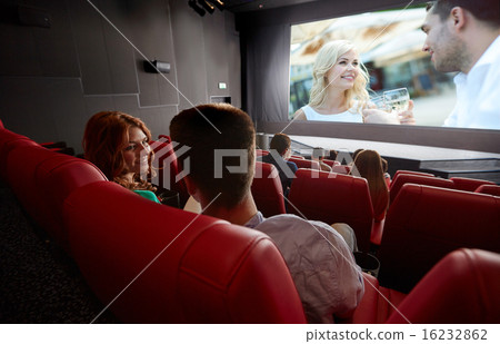happy couple watching movie and talking in theater 16232862