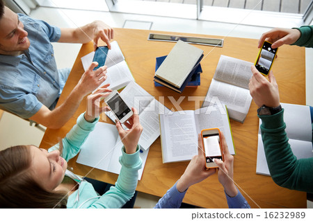 students with smartphones making cheat sheets students with smartphones making cheat sheets 16232989