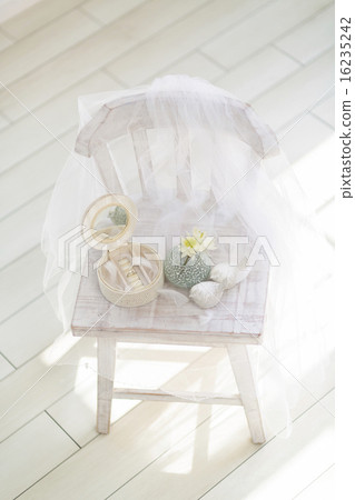 Jewelry boxes and flowers on chairs Jewelry boxes and flowers on chairs 16235242