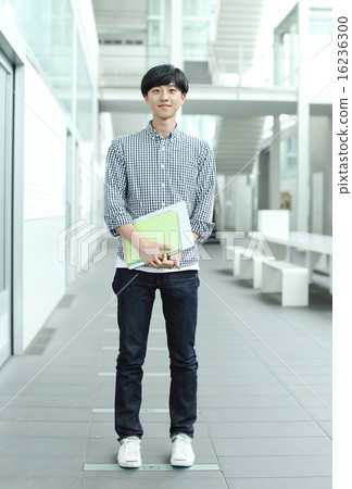 College students standing in the hallway of the university 16236300