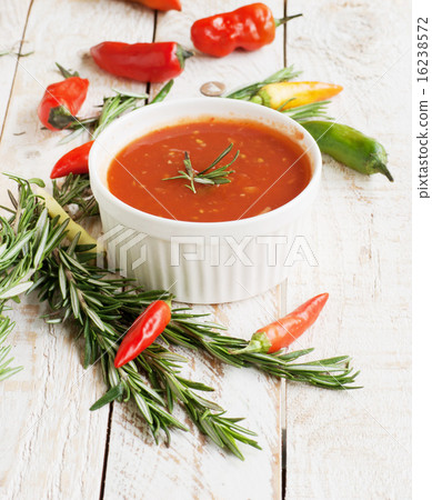bowl of tomato hot sauce with peppers 16238572