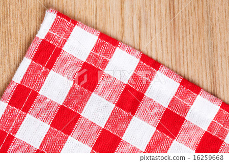 checkered tablecloth on wooden table 16259668