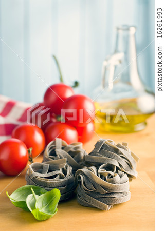 tagliatelle pasta with tomato and basil leaf 16261993