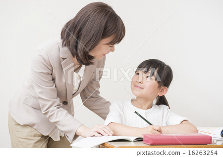 A girl studying and a teacher 16263254
