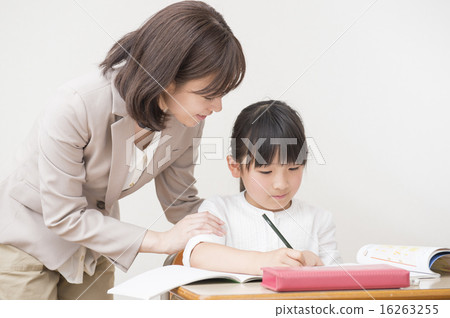 A girl studying and a teacher 16263255