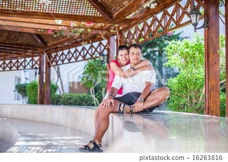 Young couple sitting on the terrace Young couple sitting on the terrace 16263816