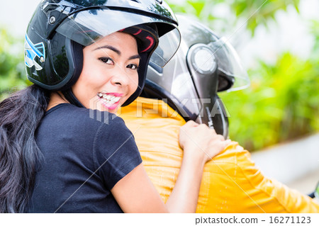 Asian couple riding motorcycle 16271123
