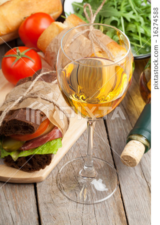 White wine glass and sandwiches 16274588