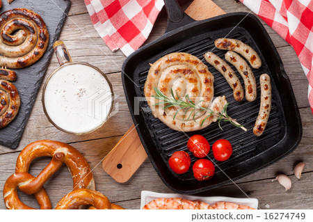 Beer mug, grilled shrimps, sausages and pretzel 16274749