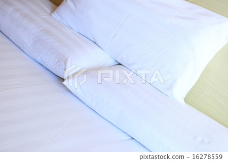 bedclothes and pillows on bed 16278559