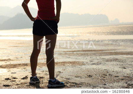 young asian woman runner on beach young asian woman runner on beach 16280846