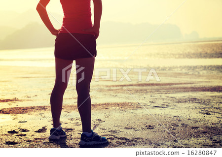 young asian woman runner on beach young asian woman runner on beach 16280847
