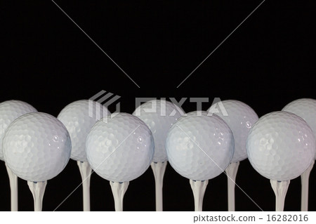 White golf balls on a white tees 16282016