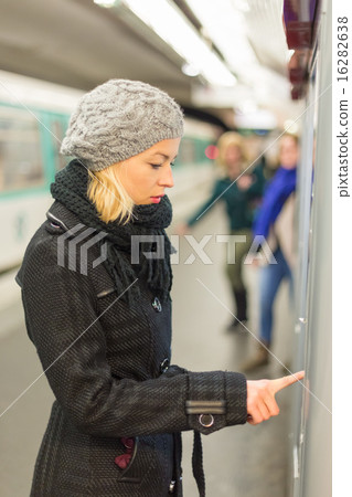 Lady buying ticket for public transport. 16282638