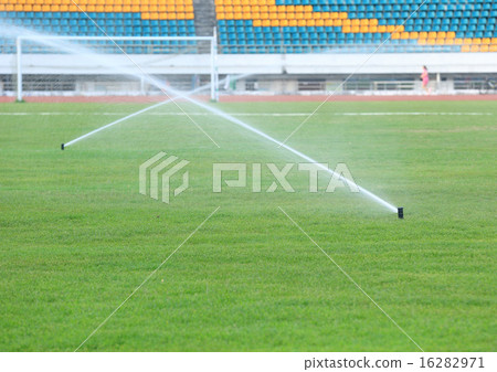 automatic watering system on green grass automatic watering system on green grass 16282971