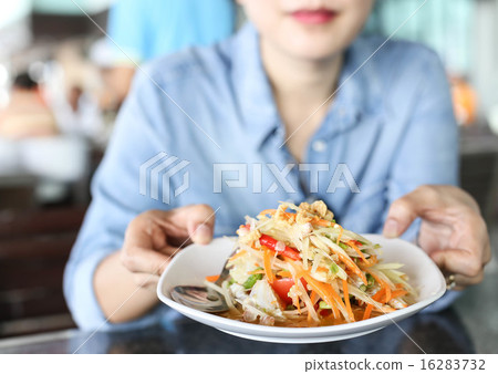 Woman holding a Thai papaya salad with horse crab 16283732