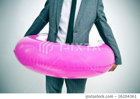 businessman with a pink swim ring, vignette added 16284361