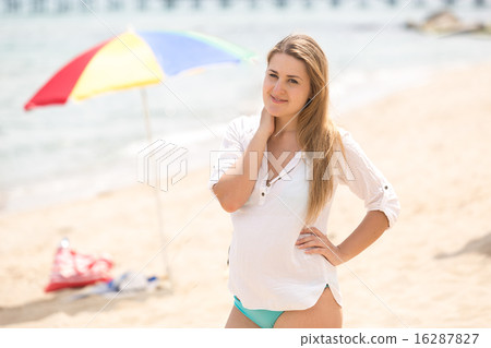 woman relaxing on beach at sunny day 16287827