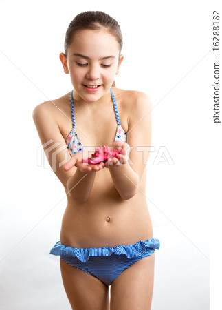 little girl in swimsuit playing with red starfish - Stock Photo [16288182]  - PIXTA