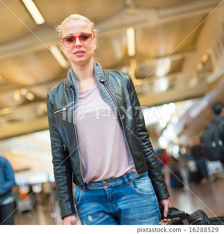 Female traveller walking airport terminal. Female traveller walking airport terminal. 16288529