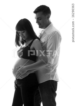 Caucasian man holding asian pregnant woman with - Stock Photo [16290363]  - PIXTA