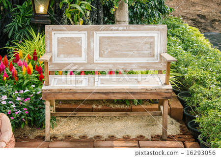 wood chair furniture in a beautiful garden. wood chair furniture in a beautiful garden. 16293056