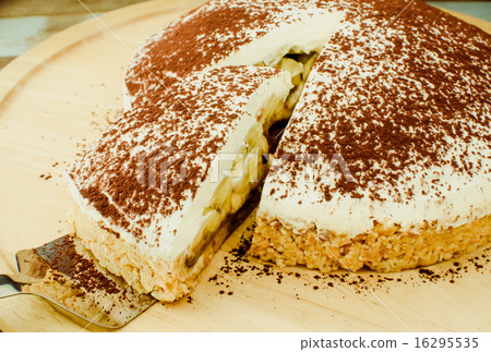 Banoffee pie on wooden plate in soft light 16295535