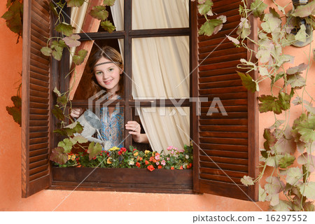 Young girl near the window Young girl near the window 16297552