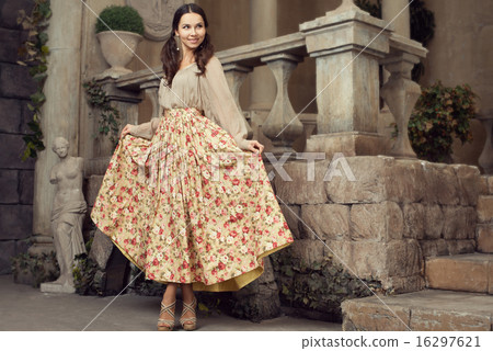 Young beautiful woman in flower skirt 16297621