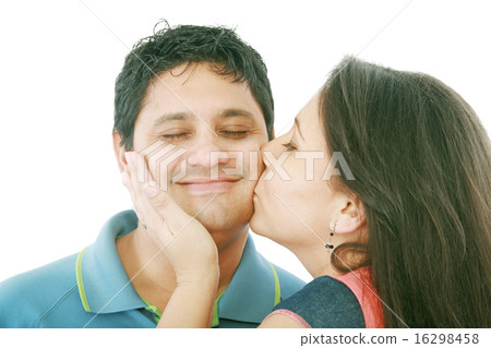Nice girl kisses the young modest guy on a cheek 16298458
