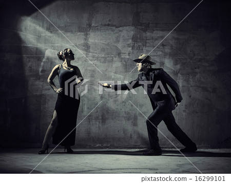 Man and woman dancers, concrete building surroundings 16299101
