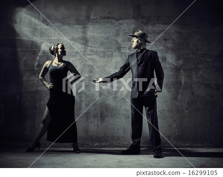 Man and woman dancers, concrete building surroundings 16299105