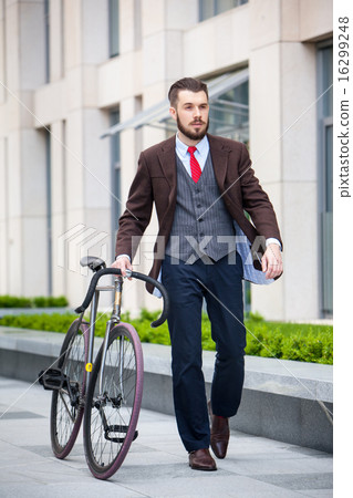Handsome businessman and his bicycle 16299248