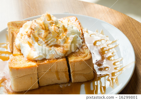 Golden honey toast with whipped cream on top 16299801