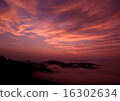Morning glow stained mountain clouds 16302634